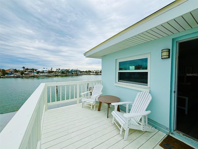 wooden deck with a water view