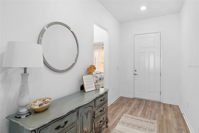 foyer entrance with light wood-type flooring