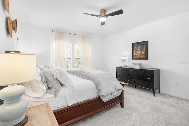 bedroom featuring ceiling fan and light colored carpet