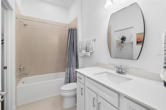 full bathroom with toilet, vanity, tile patterned floors, and shower / tub combo with curtain