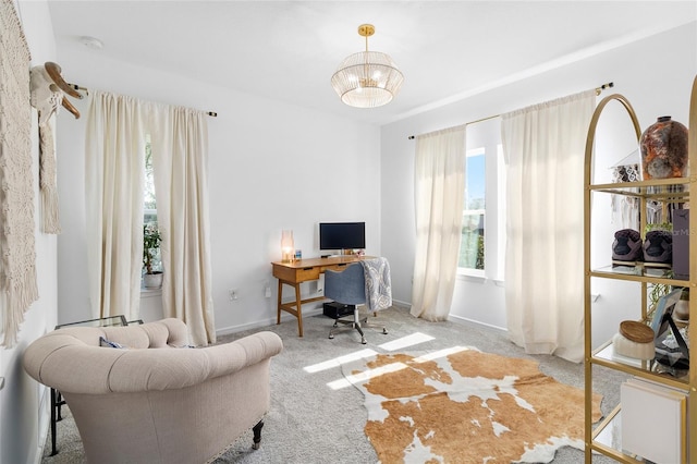 carpeted office space featuring a wealth of natural light and an inviting chandelier