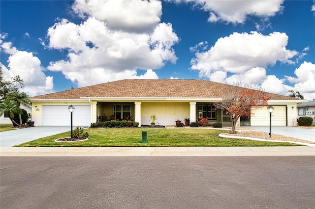 ranch-style home with a garage and a front yard