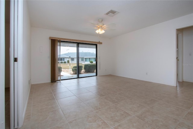 empty room featuring ceiling fan and light tile patterned floors