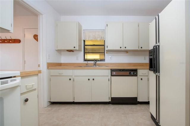 kitchen with range, dishwasher, white cabinetry, sink, and light tile patterned floors