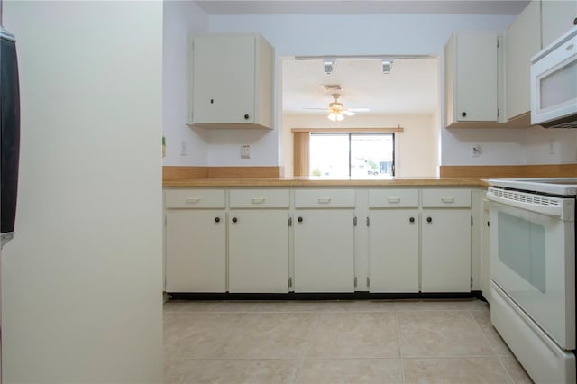 kitchen featuring light tile patterned flooring, ceiling fan, white cabinetry, and white appliances