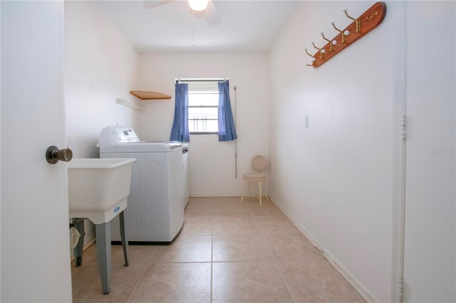 laundry room featuring ceiling fan, light tile patterned flooring, and washer / clothes dryer