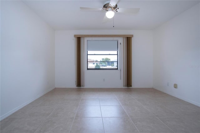 unfurnished room with ceiling fan and light tile patterned floors