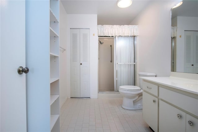 bathroom with toilet, vanity, tile patterned flooring, and a tile shower