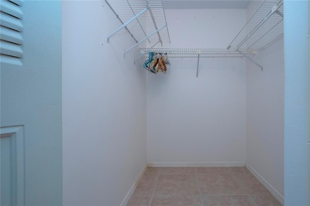 walk in closet featuring light tile patterned floors