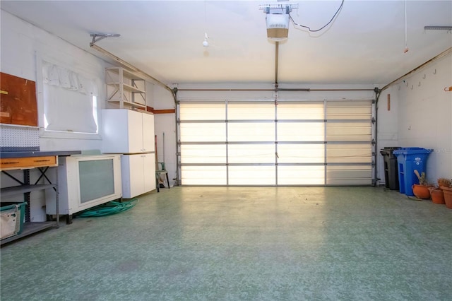 garage featuring a garage door opener