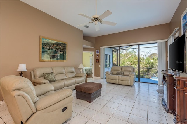 tiled living room with ceiling fan