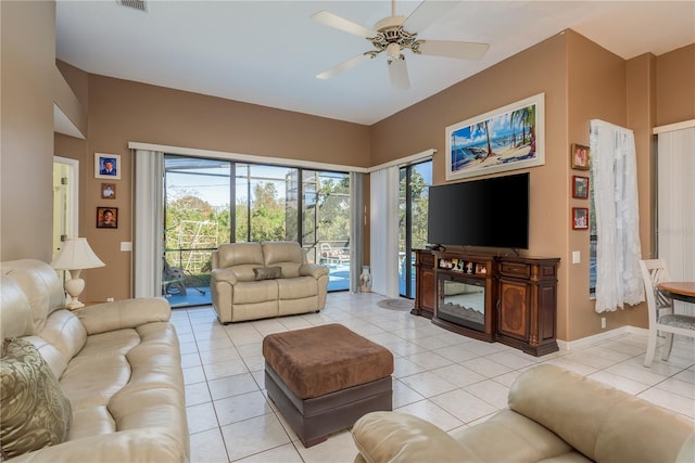 living room featuring light tile patterned floors and ceiling fan