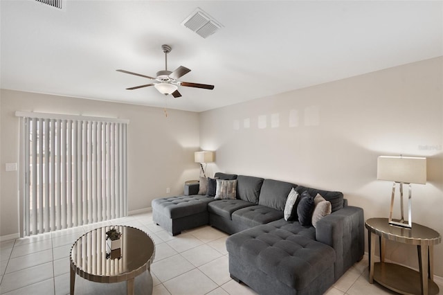 tiled living room with ceiling fan