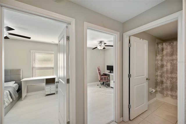 corridor with light tile patterned floors