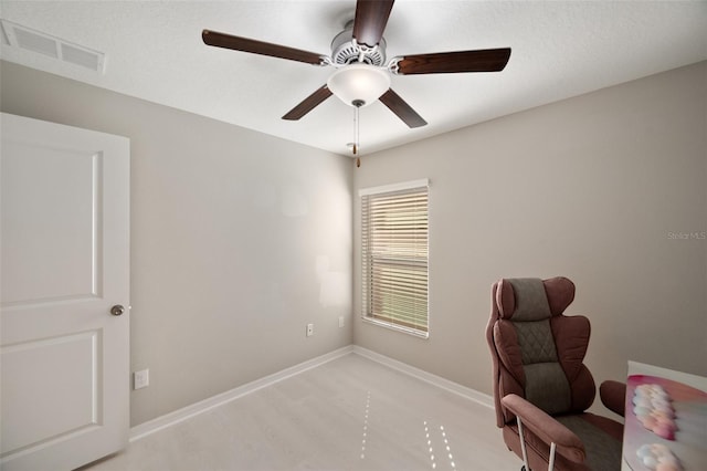 unfurnished office with ceiling fan