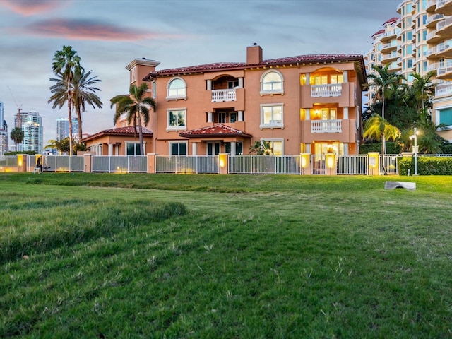 view of outdoor building at dusk