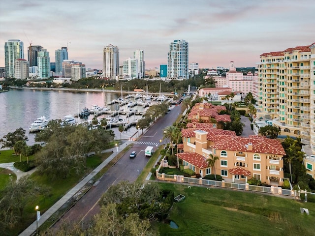 aerial view at dusk with a water view