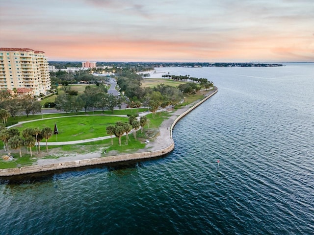 aerial view at dusk with a water view