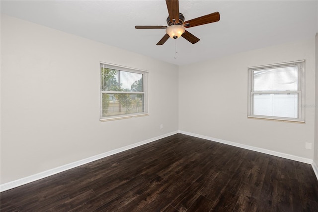 unfurnished room featuring ceiling fan and dark wood-type flooring