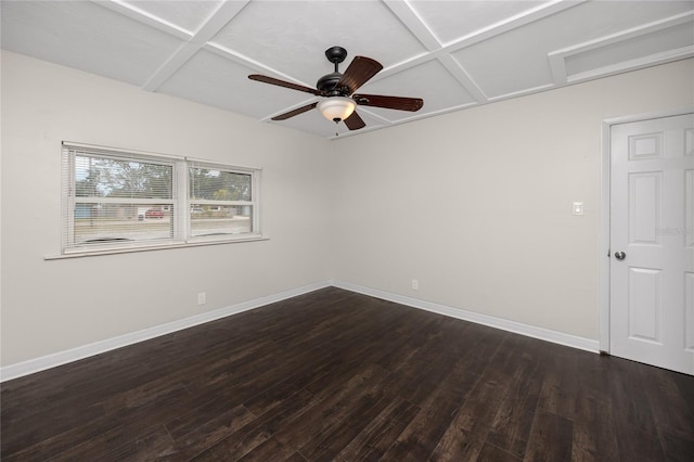 unfurnished room with ceiling fan, dark hardwood / wood-style floors, and coffered ceiling