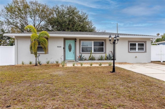 ranch-style house with a front yard