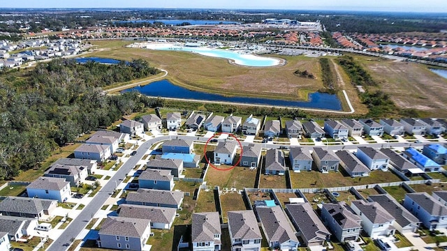 birds eye view of property featuring a water view