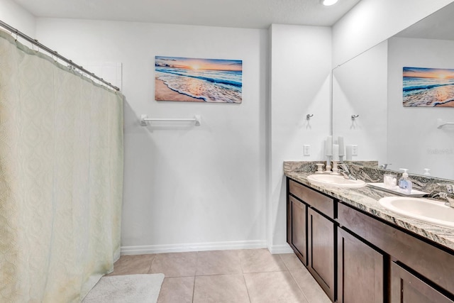 bathroom featuring tile patterned flooring and vanity