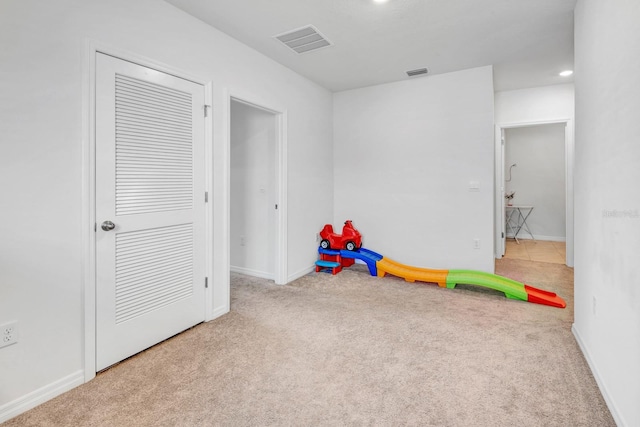 playroom featuring light colored carpet