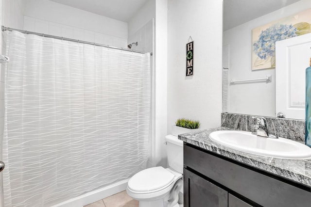 bathroom with toilet, vanity, tile patterned flooring, and a shower with shower curtain