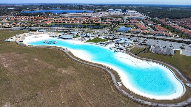 bird's eye view with a water view and a view of the beach