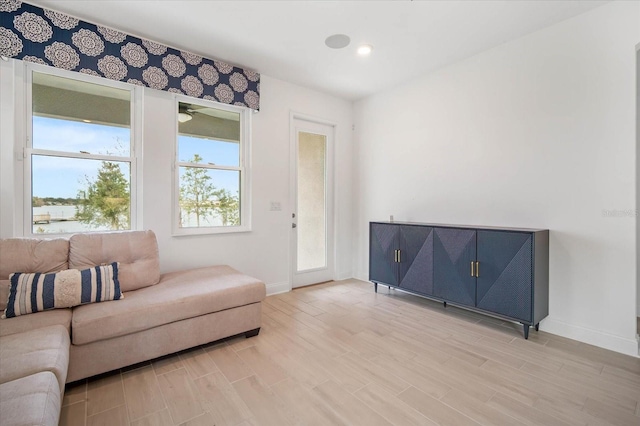 living area with light hardwood / wood-style floors