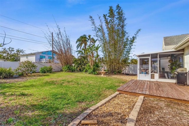 view of yard featuring a sunroom and fence