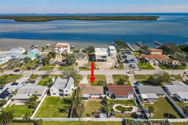 birds eye view of property featuring a residential view and a water view