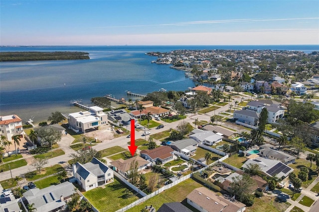 birds eye view of property with a residential view and a water view