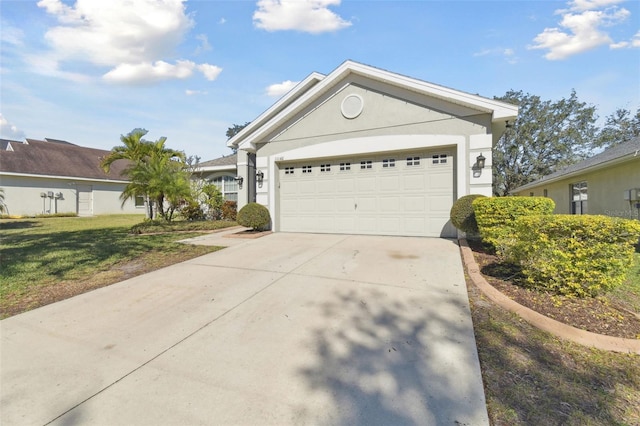 single story home with a garage and a front lawn