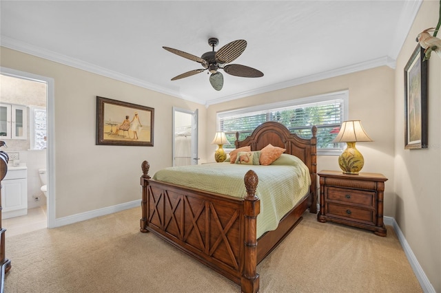 carpeted bedroom featuring ceiling fan, ensuite bathroom, and ornamental molding