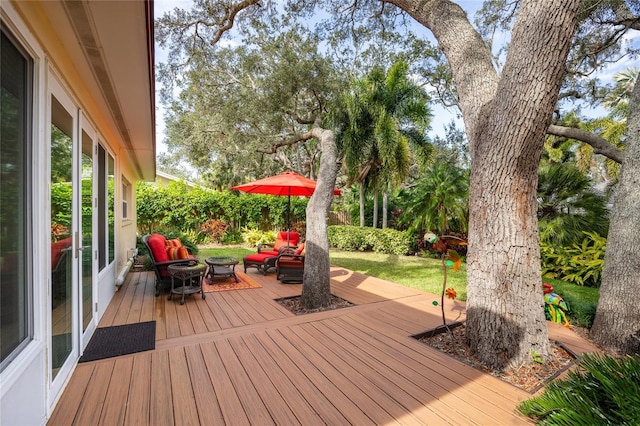 wooden terrace featuring outdoor lounge area