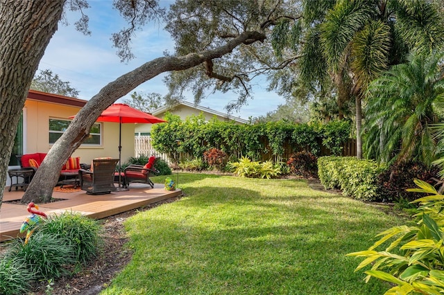 view of yard with a wooden deck