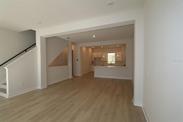 unfurnished living room featuring light hardwood / wood-style flooring