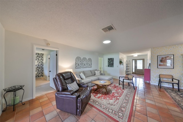 tiled living room with a textured ceiling