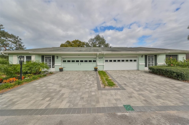 ranch-style home featuring a garage