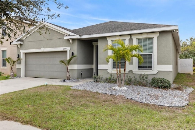 view of front facade featuring a garage and a front yard