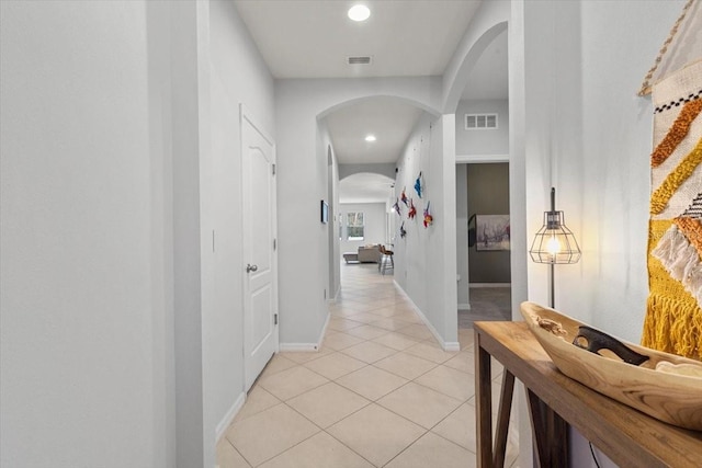 hallway with light tile patterned floors