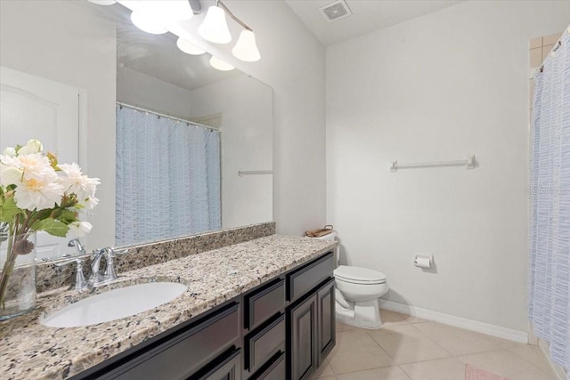 bathroom featuring an inviting chandelier, tile patterned floors, toilet, and vanity