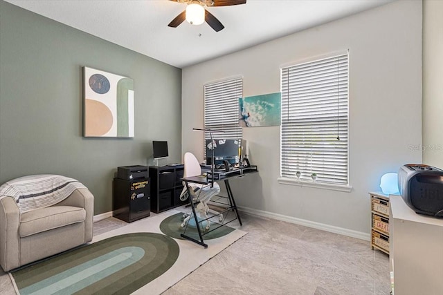 carpeted office space with ceiling fan