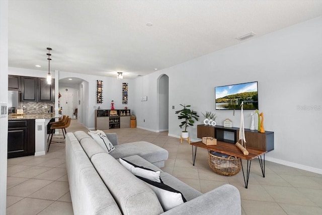 living room with light tile patterned flooring