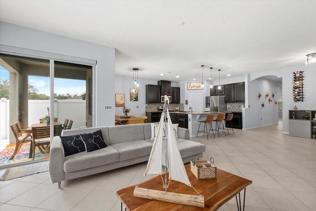 living room with light tile patterned flooring