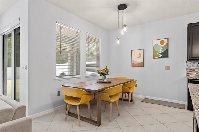 dining space featuring light tile patterned floors