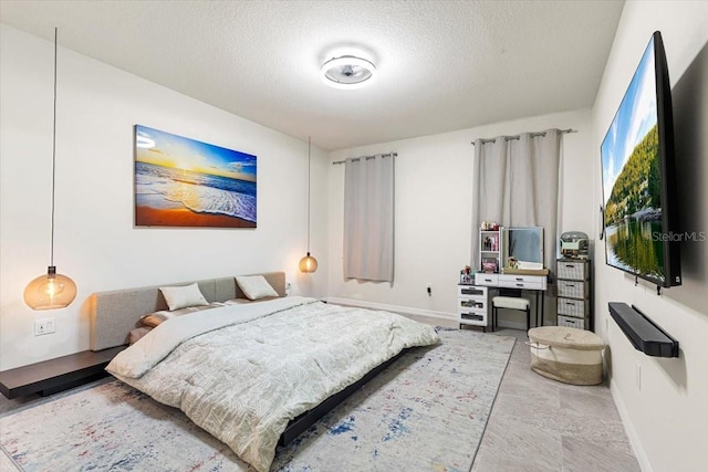 bedroom featuring a textured ceiling