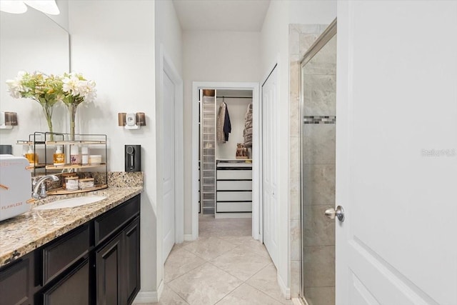 hall featuring sink and light tile patterned floors